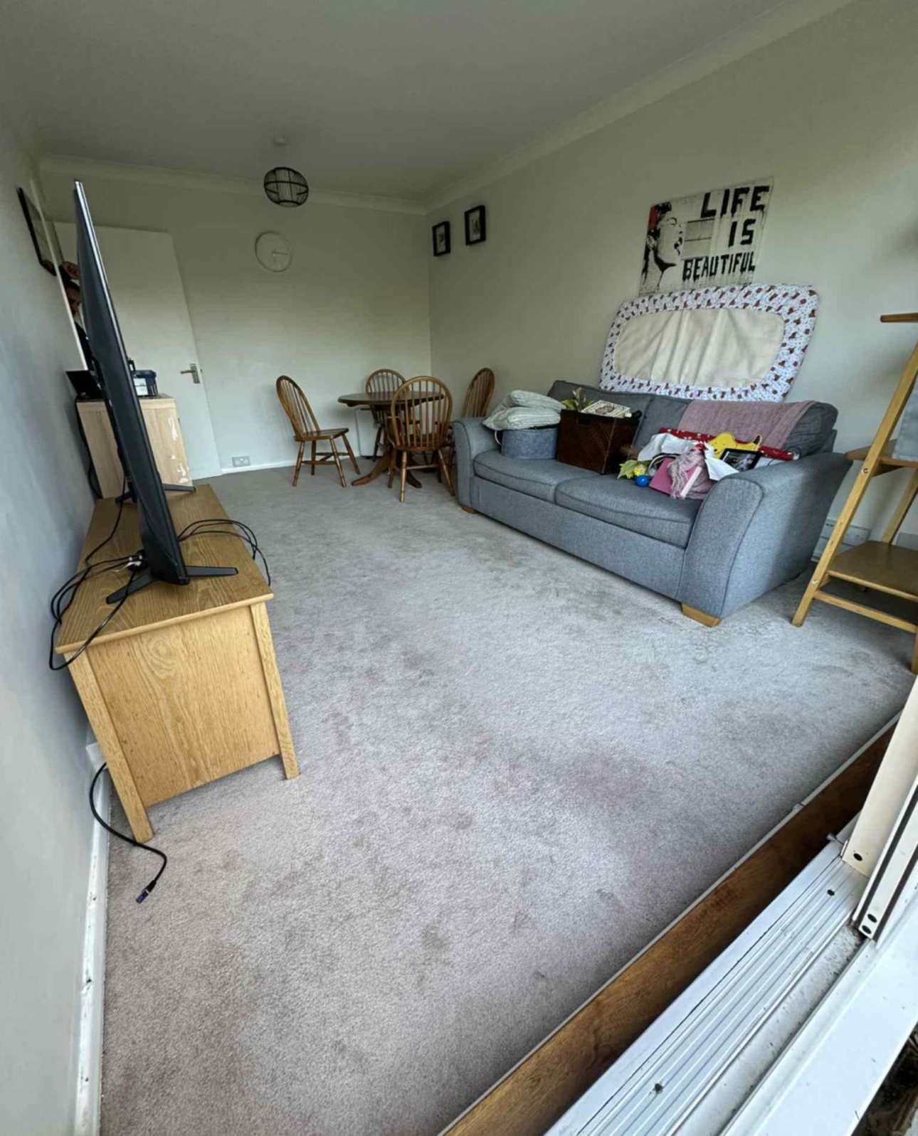 Spacious living room with cleaned carpet
