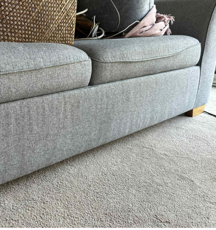 Close-up of cleaned sofa and carpet